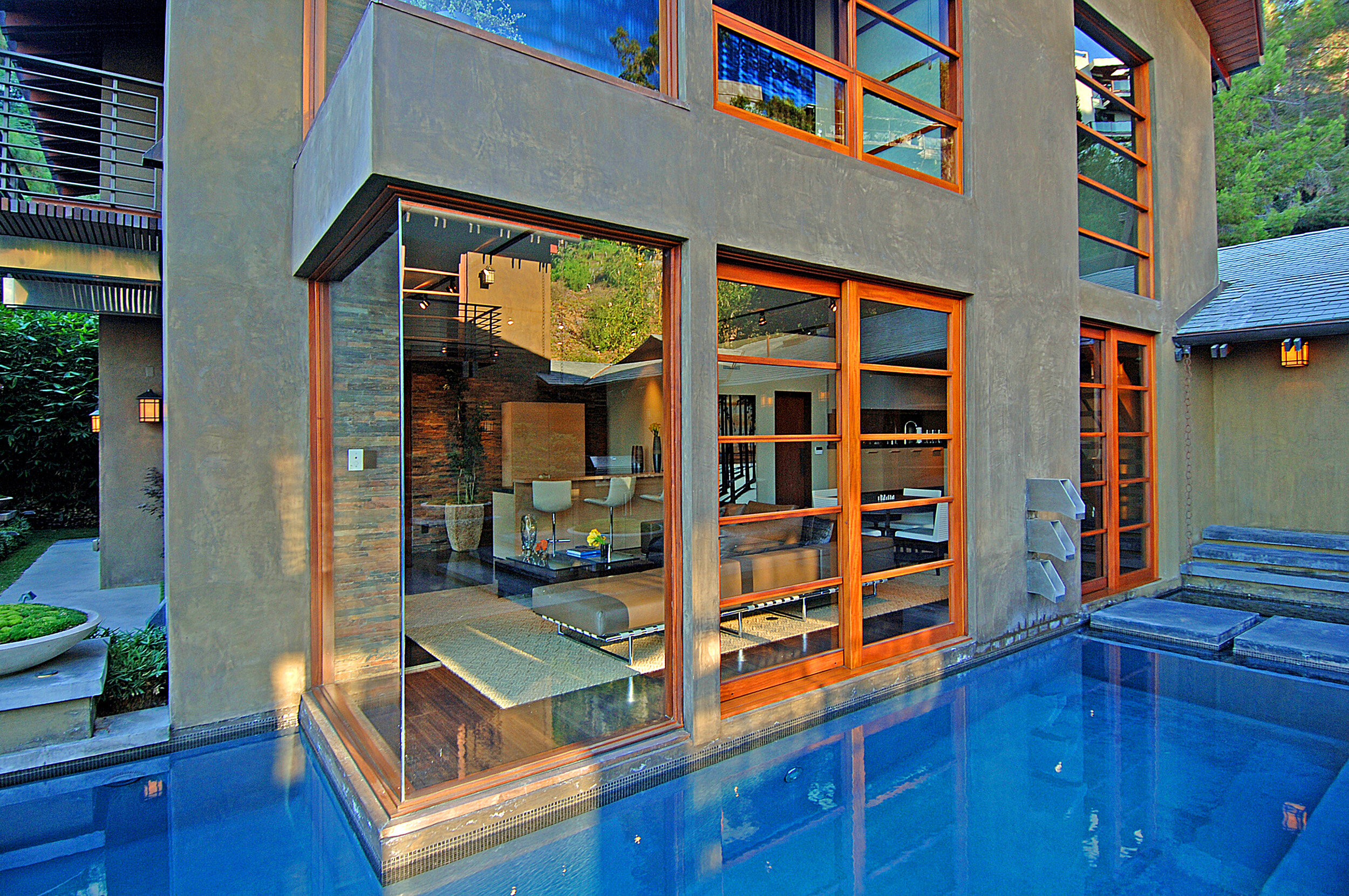 9342 sierra mar, a custom hollywood hills home with warm modern design & luxury water — whipple russell architects