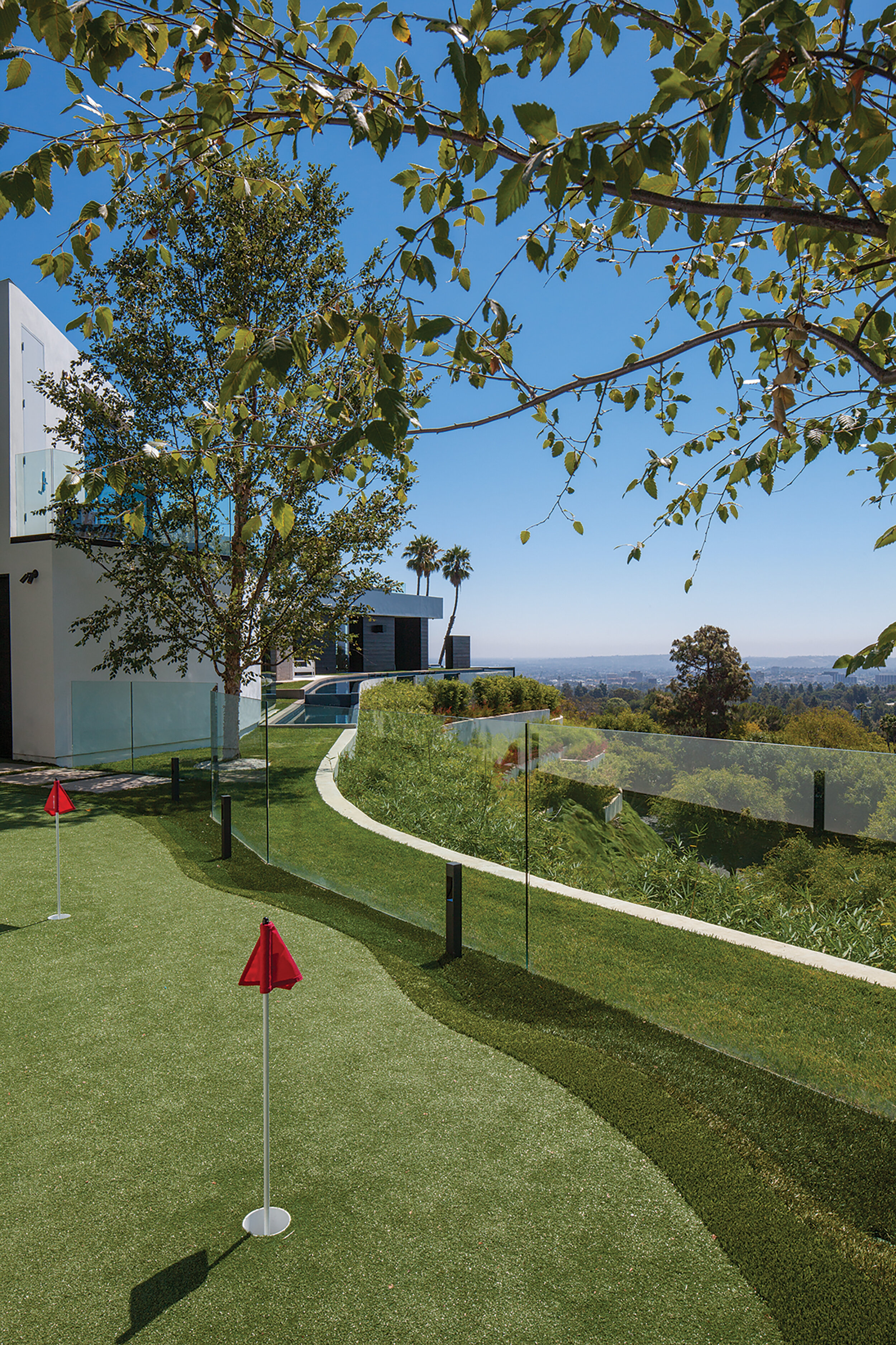 modern beverly hills home with moat style pool, hilltop views & fire features — whipple russell architects