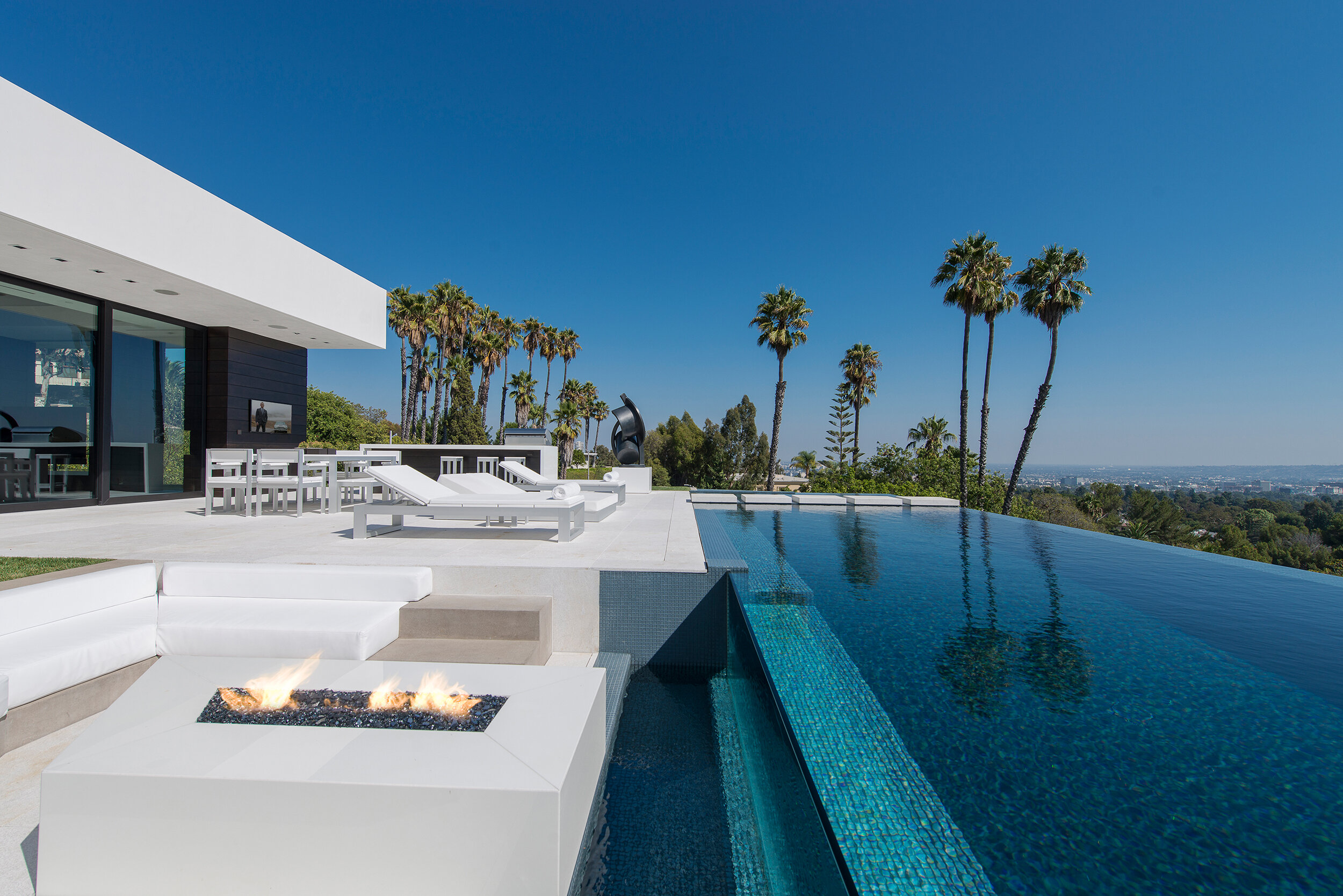 modern beverly hills home with moat style pool, hilltop views & fire features — whipple russell architects