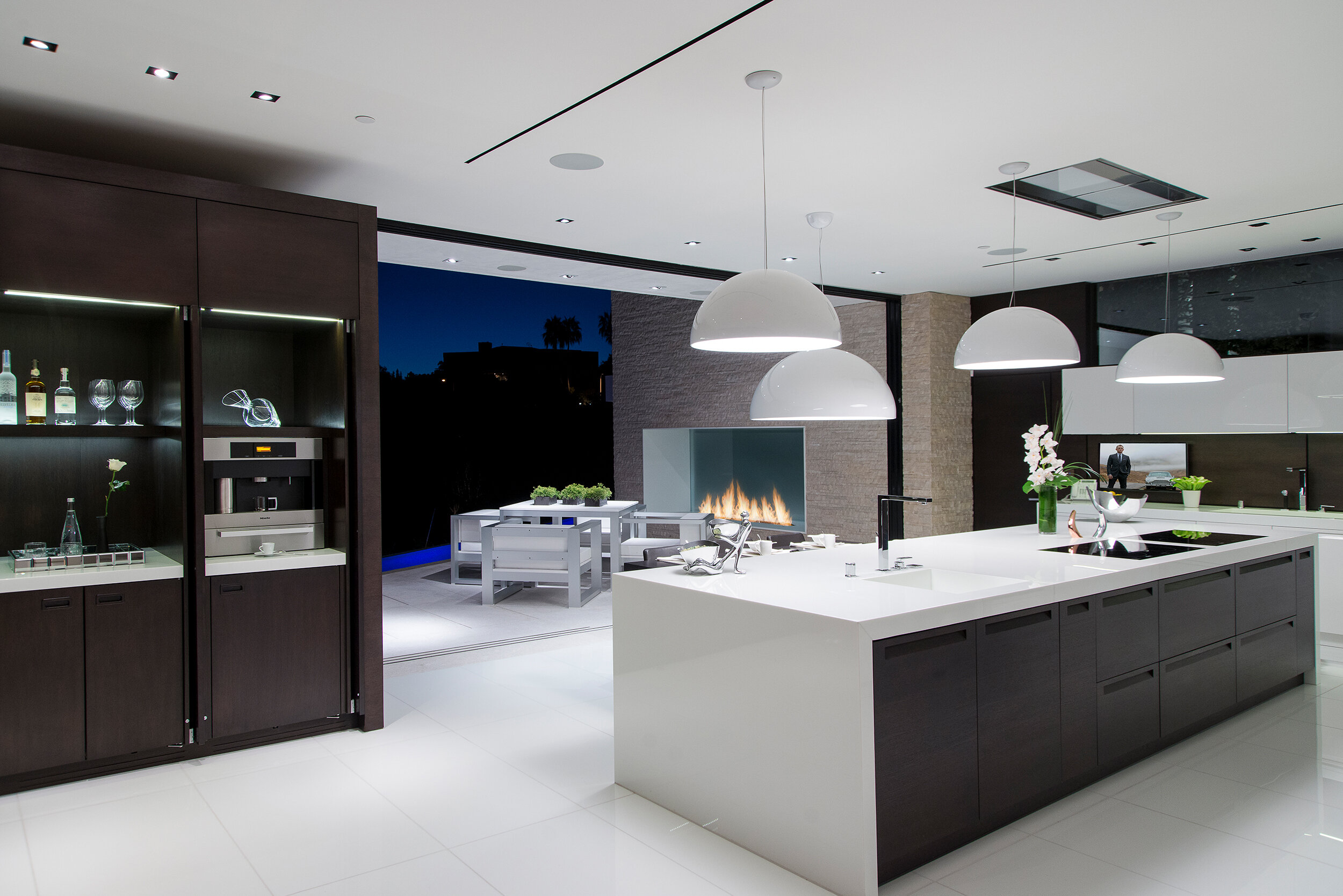 modern beverly hills home with moat style pool, hilltop views & fire features — whipple russell architects
